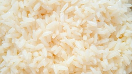 Fototapeta premium Close-Up View of Steamed White Rice Grains Piled Together for Culinary and Food Photography Use in Dishes, Recipes, and Gastronomy Illustrations