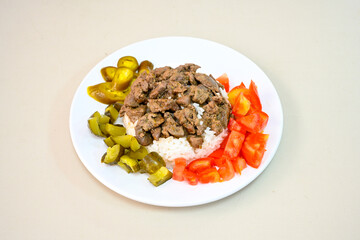 Famous Urfa meat liver, ciger wrapped by lavash with roasted chili pepper, onion and sauce in Sanliurfa, Turkey. Kuzu et ciger sis. Izgara dana bonfile, cop sis, kuzu pirzola. Karisik kebap, beyti keb