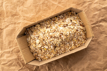 Oatmeal rolled with homemade kitchen utensils, close-up, top view.