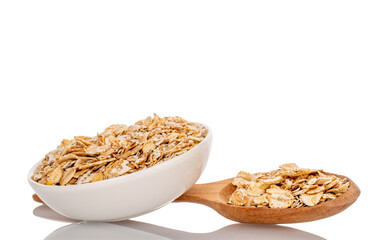 Oatmeal rolled with home kitchen utensils, close-up,  isolated on white background