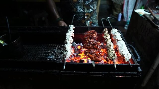 Varieties of chicken kebabs like reshmi, tandoori, and seekh kebab are sold in roadside stalls in India