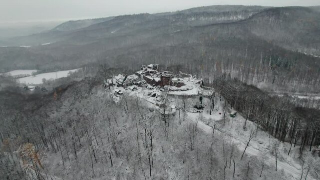 Aerial view ruins of old castle. Winter. Ruin of Hohnstein Castle, Harz mountains, Germany.