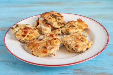 Chicken schnitzels for tasty dinner on ceramic plate.
