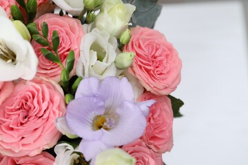 Beautiful wedding bouquet on light background, closeup. Space for text
