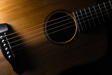 Naklejka premium Acoustic guitar on black background