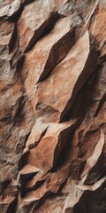 The rugged beauty of a mountain range is highlighted by striking brown rock formations. This minimal landscape captures the essence of nature's raw textures and colors