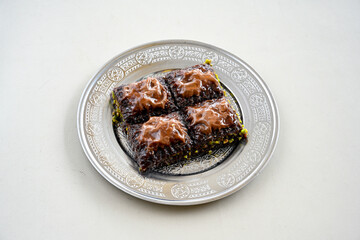 Turkish Dessert Sobiyet, havuc dilimi, midye baklava, mussels baklava and classic baklava with Pistachio . Cikolatali cevizli, fistikli soguk Baklava, top view.
