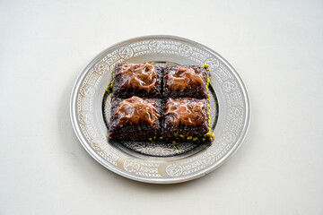 Turkish Dessert Sobiyet, havuc dilimi, midye baklava, mussels baklava and classic baklava with Pistachio . Cikolatali cevizli, fistikli soguk Baklava, top view.