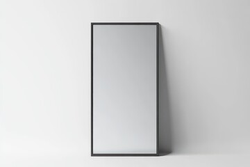 Gray rectangular mirror with a slim frame isolated on a neutral background