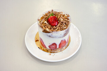 Strawberry magnolia dessert. Magnolia with strawberry and cream filling on a white background. close up. Cilekli Muzlu Magnolia. Antep fistikli cilekli mag