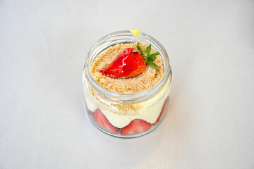 Strawberry magnolia dessert. Magnolia with strawberry and cream filling on a white background. close up. Cilekli Muzlu Magnolia. Antep fistikli cilekli mag