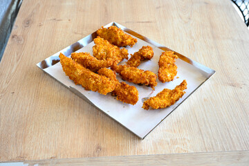 Homemade fried chicken nuggets isolated on white background. Chicken nugget. Citir tavuk. Citir, tavuk atistirma  tabagi.