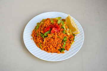 Traditional turkish bulgur pilaf with tomato sause in plate (Turkish name; bulgur pilavi, meyhane pilavi) Pirinc pilavi. Pilavustu tavuk, nohut, kuru fasulye, ciger.