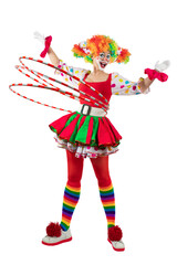Funny female clown twirling hula hoop, woman entertainer dressed as a colorful Joker in a suit and...