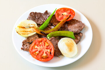 Famous Urfa meat liver, ciger wrapped by lavash with roasted chili pepper, onion and sauce in...
