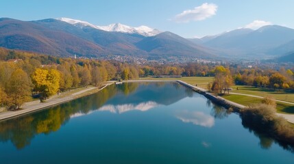 Fototapeta premium Serene Landscape with Reflections of Mountains and Trees in a Lake