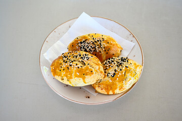 Turkish pastry product , tasty pogaca. Simit, gevrek. Turkish Pastries; peynirli, patatesli, kasarli pogaca, borek, acma, ay coregi at patisserie showcase.