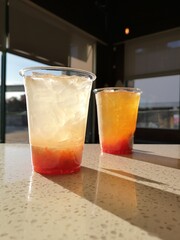 Orange yellow grapefruit and lemonade lemon iced drink cafe background dramatic shadkw