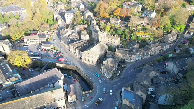 Aerial footage of the center of Holmfirth town in, West Yorkshire, England, UK, on a sunny day