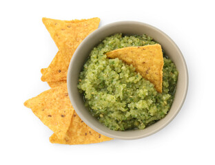 Delicious homemade green salsa with nachos isolated on white, top view