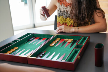 Playing backgammon with focus on strategy and concentration