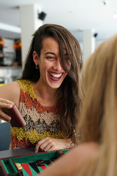 Women enjoying a game of backgammon