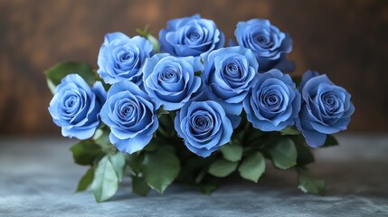 Bouquet of blue roses on grey surface.
