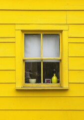 Obraz premium A yellow house with a window that is open