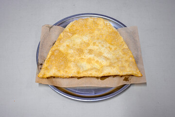 Turkish style meat stuffed filo dough borek served kol boregi.Cheese and minced pie are sliced on a marble background. Turkish name: Kol Boregi, kiymali, peynirli su boregi. Ci borek. Kafkas cig borek