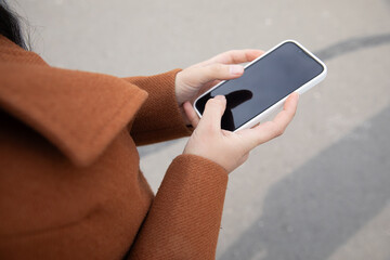 woman with a smartphone in the park