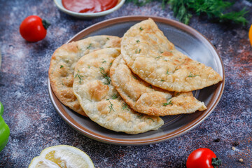 Traditional Russian deep fried meat pies - chebureki.