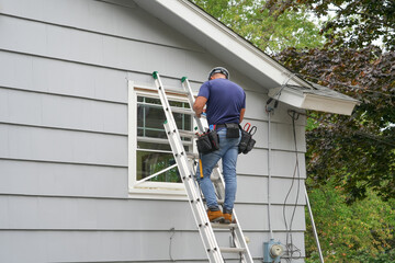 Fototapeta premium contractor working on replacing the window of the house