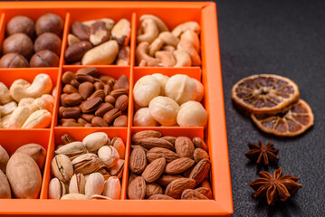 Box with various nuts cashew, macadamia, peanut, cedar, pecan, walnut, brazil, hazelnut