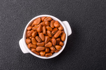 Delicious nutritious cedar nuts in ceramic bowl