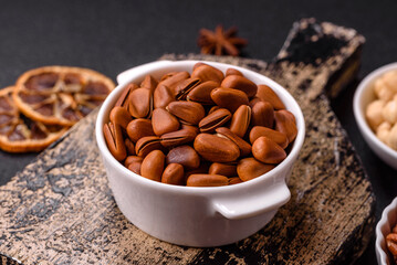 Delicious nutritious cedar nuts in ceramic bowl