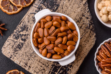 Delicious nutritious cedar nuts in ceramic bowl