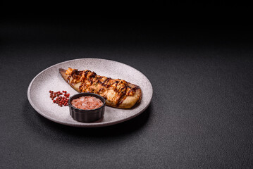 Grilled mackerel fillets with cheese, salt, spices and herbs