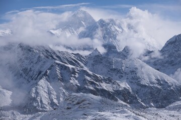 Amazing winter scenery of Himalaya panorama with Mount Everest among clouds from route to Renjo La Pass. Sagarmatha National Park, Himalayas, Nepal