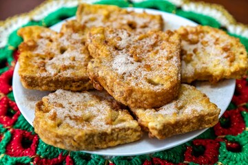 Traditional sweet Christmas French toast served with cinnamon sugar in a Christmas setting