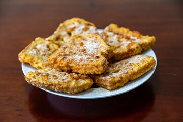 Traditional sweet Christmas French toast served with cinnamon sugar in a Christmas setting
