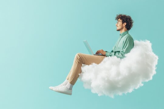 Young man sitting on a cloud while working on a laptop in a bright and serene environment