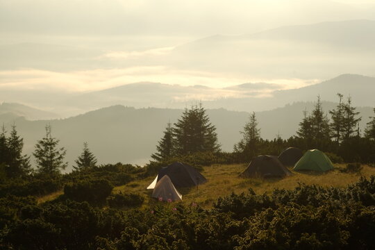 Tourist camp on a mountain meadow on a sunny morning.