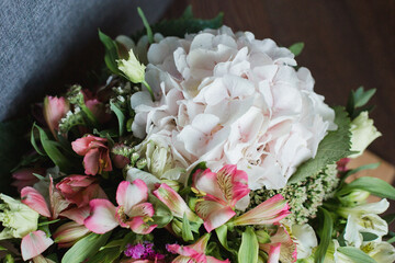 Bouquet of flowers with hydrangea, alstroemeria, poppy, eustoma and greenery