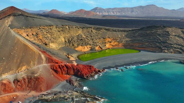 Lanzarote volcanic Lake and ocean beach in El Golfo, Canary Islands, Spain, tourism in the Canaries, aerial view of Lanzarote natural landmark