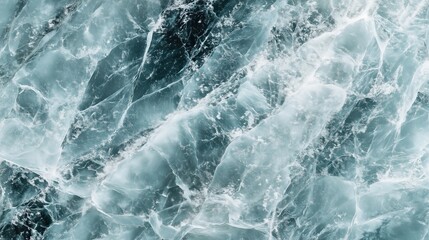 Obraz premium top view on flat blue ice with cracks surface texture background