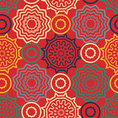 Seamless multicolored pattern with chaotically located round decorative elements. Red background. Vector illustration