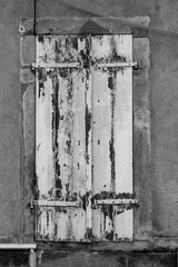 Windows with wooden shutters