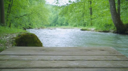 Obraz premium Tranquil Riverbank Scene with Lush Greenery and Peaceful Water Flow