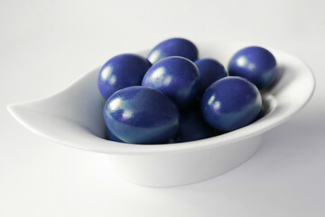 Traditional blue easter eggs. Chicken eggs are painted red. High quality photo
