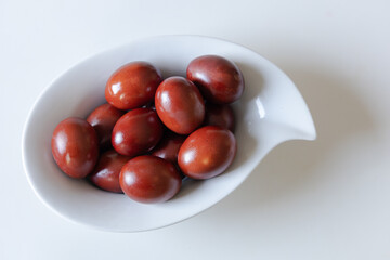 Traditional red easter eggs. Chicken eggs are painted red. High quality photo